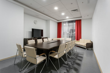 Empty modern conference hall in new hotel. Room for training, education, group classes, exams. Audience for Speakers at Business convention and Presentation.