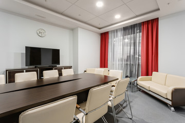 Empty modern conference hall in new hotel. Room for training, education, group classes, exams. Audience for Speakers at Business convention and Presentation.