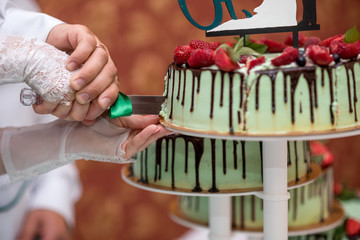 Wedding cake with flowers, figs, macarons and blueberries