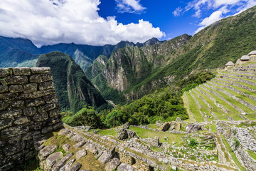 Fototapeta na wymiar The walls of Machu Picchu are overgrown with grass
