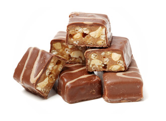 Chocolate peanut candy on white background
