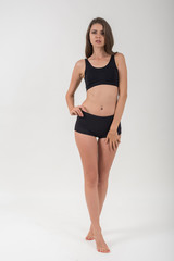 Obraz premium Beautiful woman with healthy body on white background