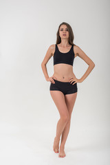 Fototapeta premium Beautiful woman with healthy body on white background