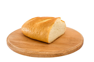 long loaf on a wooden board on a white background