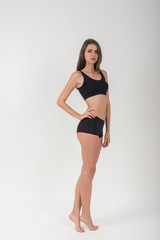 Obraz premium Beautiful woman with healthy body on white background