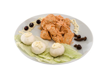 stewed chicken meat in a sauce with mushrooms. Beautiful dish on a white background