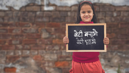 Two little Indian Rural girls holding slate board