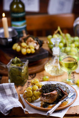 quail in grape leaves with grapes.style vintage