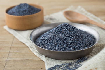 Dried poppy heads and seeds. Blue poppy in bowl