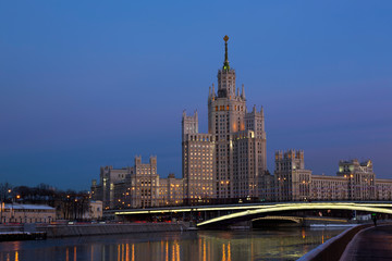 Fototapeta na wymiar One of seven Stalin skyscrapers: the high-rise building on Kotelnicheskaya Embankment in night illumination, Moscow
