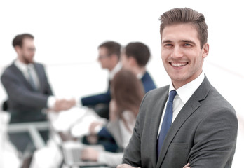 young businessman on blurred office background