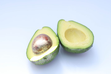 two avocado halves closeup