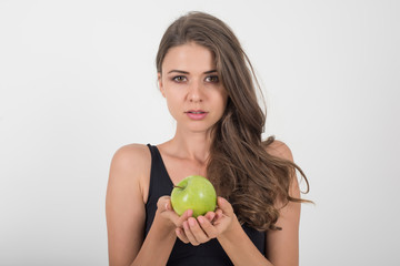 Beauty woman holding green apple while isolated on white