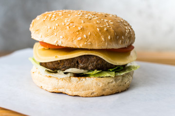 Classic burger on wooden table gray background