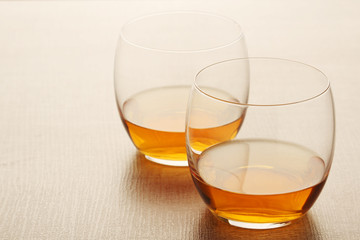 Two glasses with whiskey without ice cubes