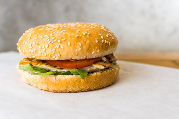 caesar burger on wooden table gray background