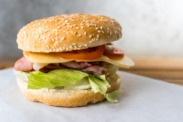 bacon burger on wooden table gray background