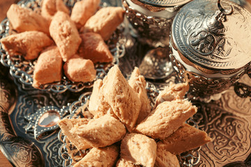 Turkish sweets with coffee on a wooden table