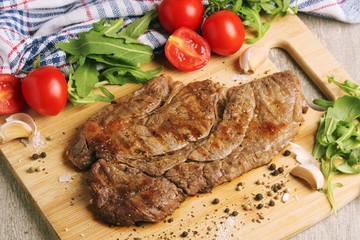 A beef steak well done with vegetables