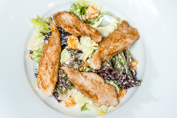 salad with chicken meat cream sauce on a white background