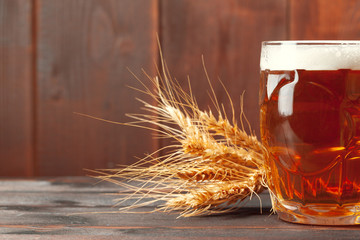 Glass beer on wood background