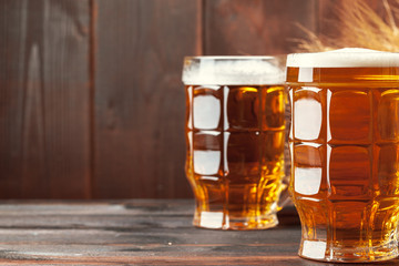 Glass beer on wood background