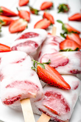 Homemade popsicle or strawberry ice cream with yogurt