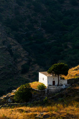 Fototapeta na wymiar Small rural church in the fields near Ioulida village on Kea island in Greece.