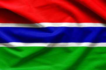 Gambia flag on satin texture.