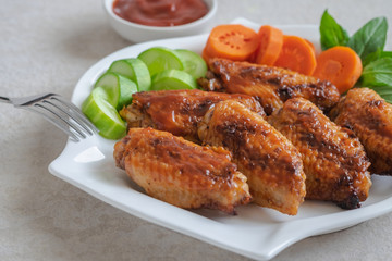 Chicken wings with barbecue sauce on plate