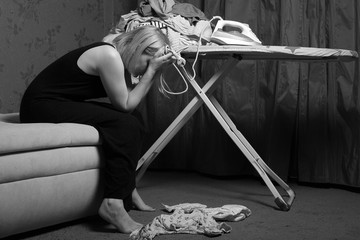 postpartum women's depression. the cleaning in the house. upset woman. wash diapers