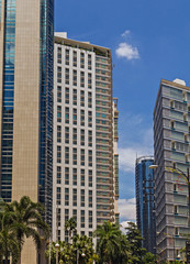 Fototapeta premium Kuala Lumpur traffic cars taxi. Frame building architecture Downtown bank hotel