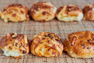 Buns with cheese on the table. Horizontal.