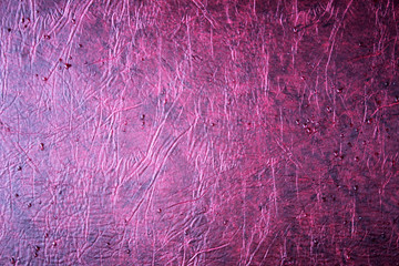 fuchsia leather background or texture with dark vignette borders