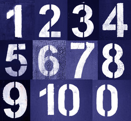 Numbers 0 to 10 in stencil on metal wall in blue