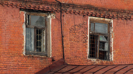 Fototapeta na wymiar Two Windows in Brick Wall