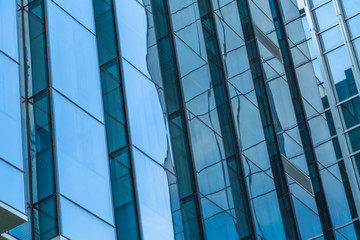 Urban abstract - windowed corner of office building.