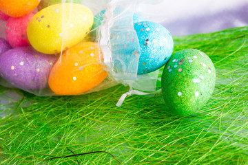 colorful easter eggs on green background
