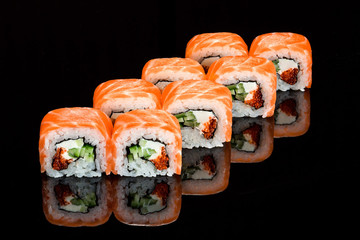 Set of sushi on black background