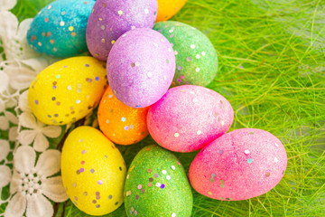 colorful easter eggs on green background