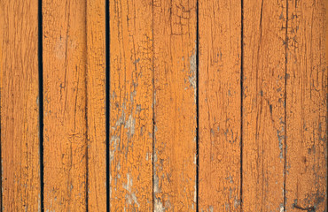 Orange color old grungy wooden planks background.