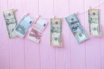 Money Laundering. Money Laundering US dollars hung out to dry. 100 dollar bills hanging on...