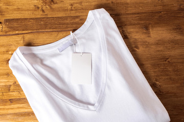White t-shirt on a wooden background