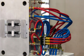 close up cooling system or water hose of plastic injection mold for mass production (manufacturing...