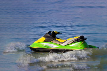 Tourists enjoy driving jetski on the ocean, Space for text. Hot summer time