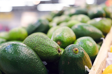 Fresh avocados in a box. Fresh vegetables for the restaurant. Vegetables for the chef. Vegetable market.