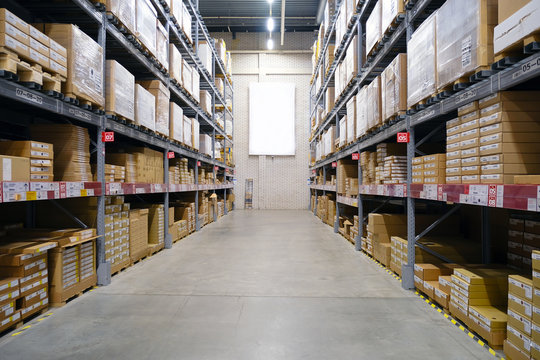 Warehouse-shop. The interior of the warehouse. The shelves in several rows.