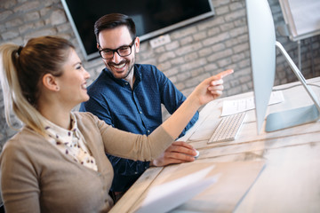 Young architects working on project in office