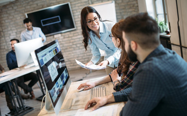 Young architects working on project in office