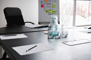 Table prepared for business meeting in conference hall